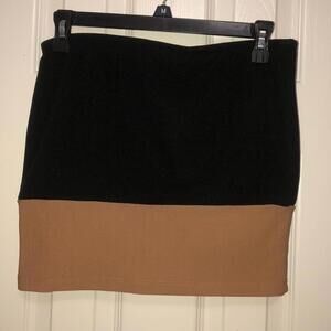 Nude and black mini skirt
